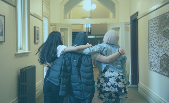 A student writes on a whiteboard